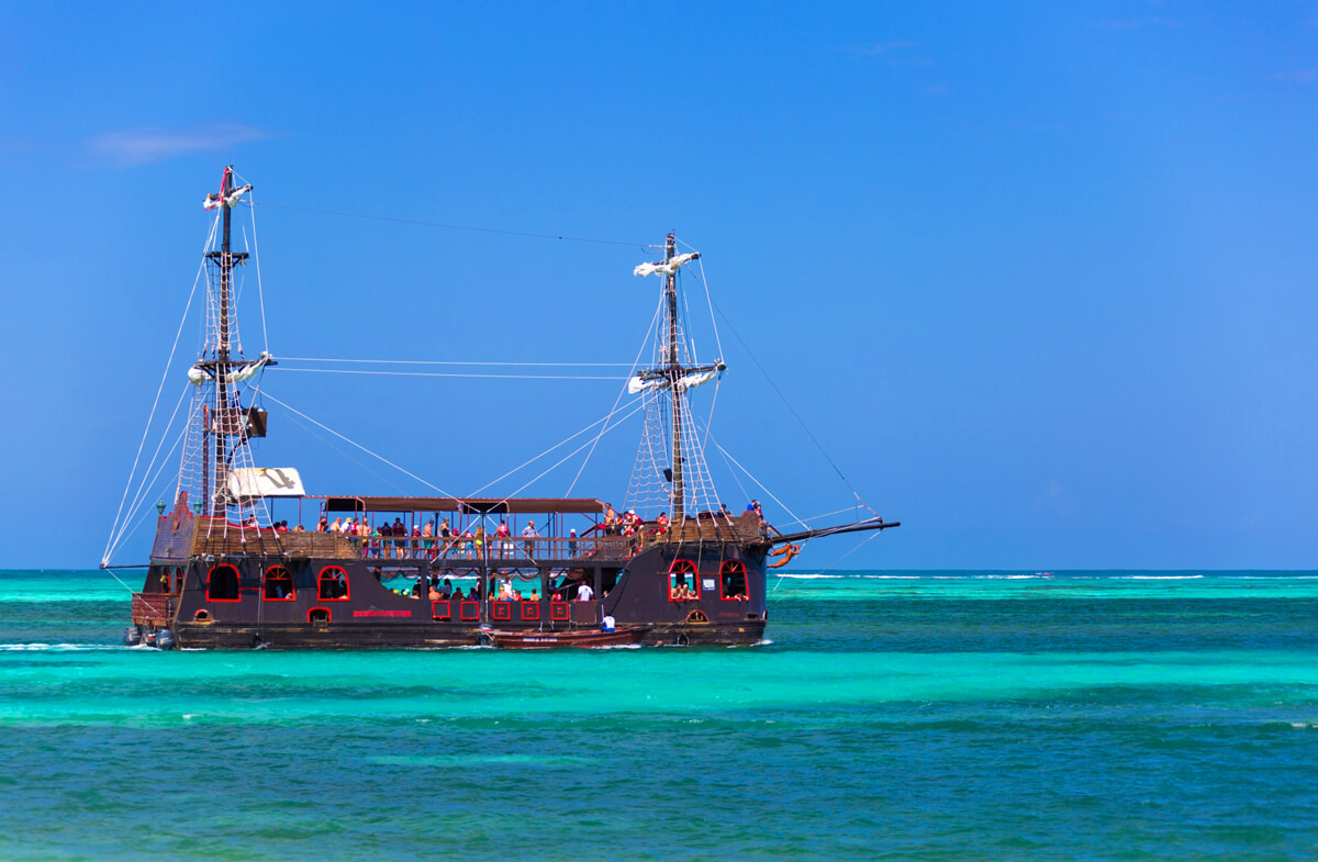 A pirate ship replica filled with adventurers