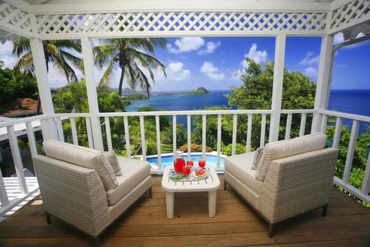 An ocean view, comfy chair, and island cocktails-- what's not to love?