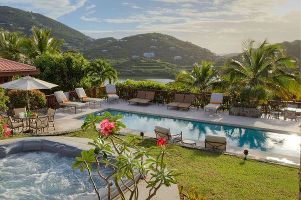 Estate Rose is a luxurious villa perched atop a scenic ridge between Great Cruz Bay and Chocolate Hole.