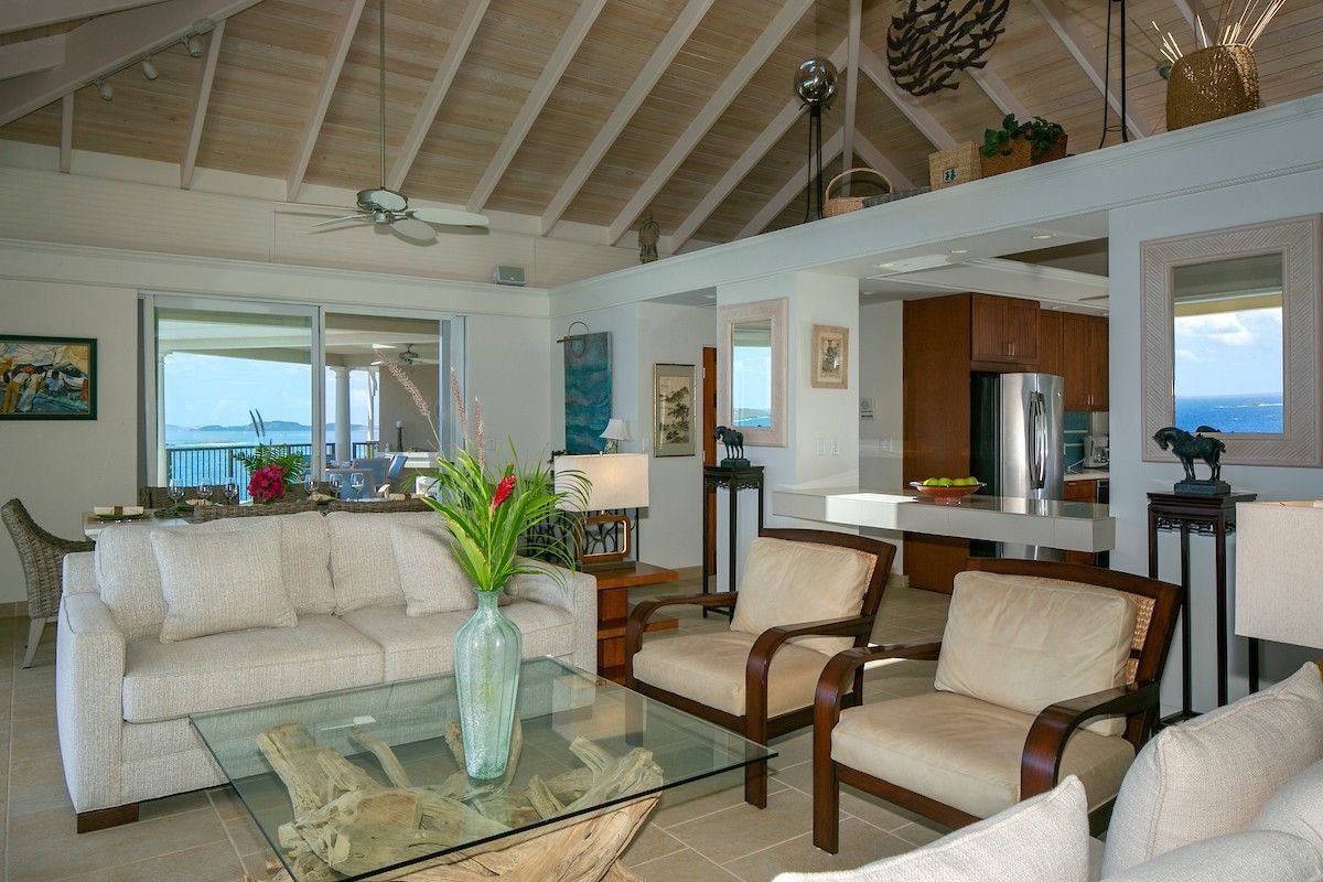 Bright villa living room with comfortable sofas and natural light