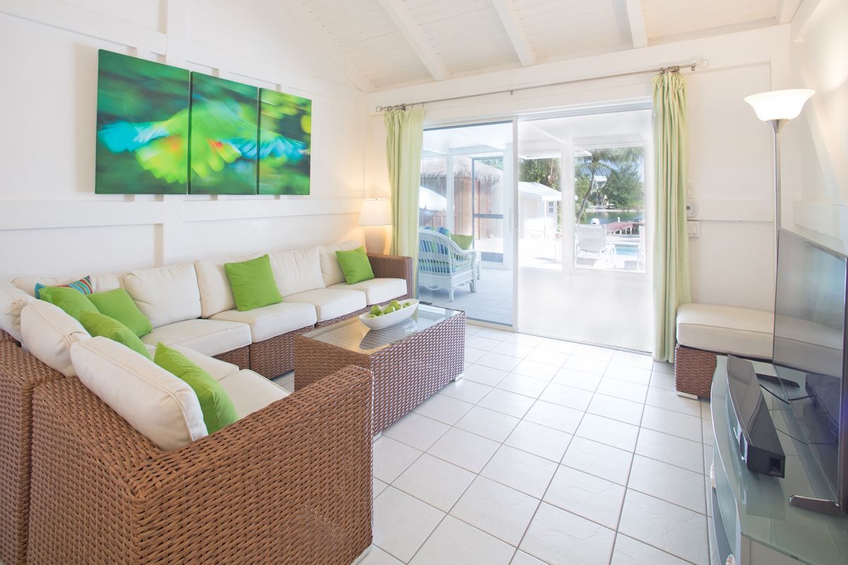 The pool patio is just outside the sliding glass doors form the living area