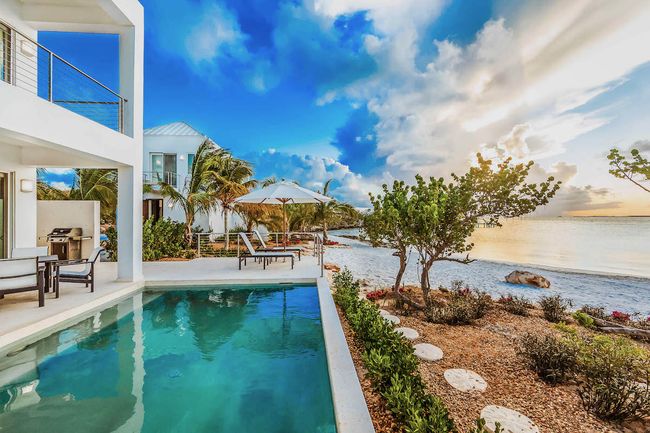 The beachfront pool at Capri Villa