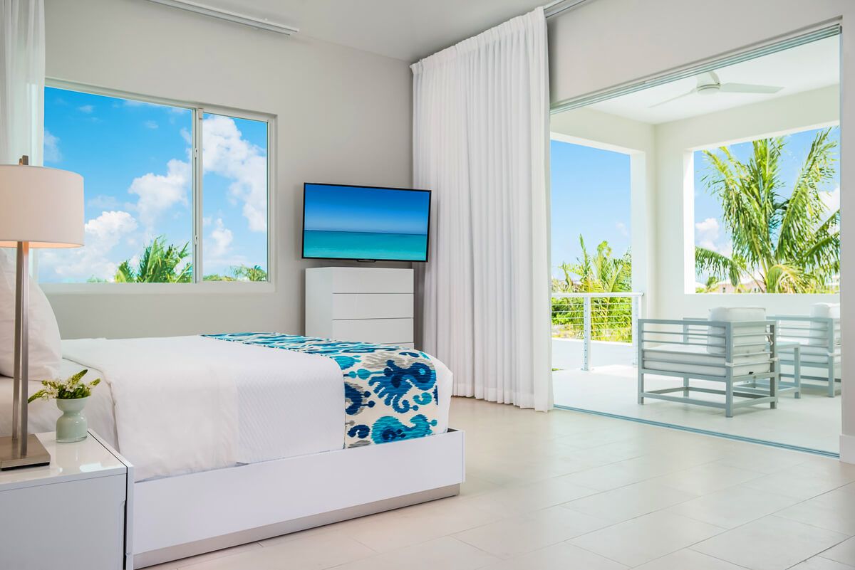 The upper level master bedroom with balcony access