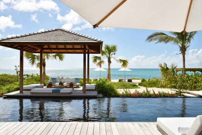 A private cabana sits beachfront at Love Pumpkin