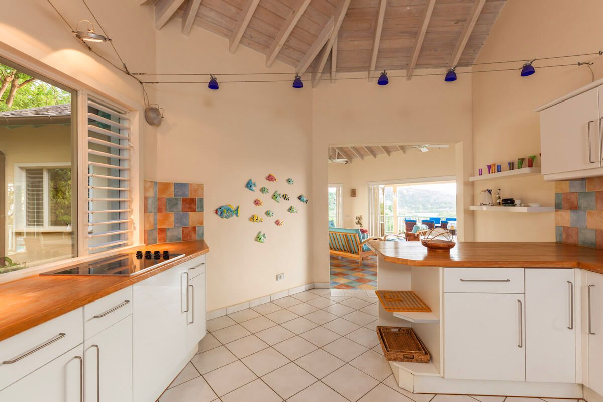 A well-equipped kitchen opens to the living area