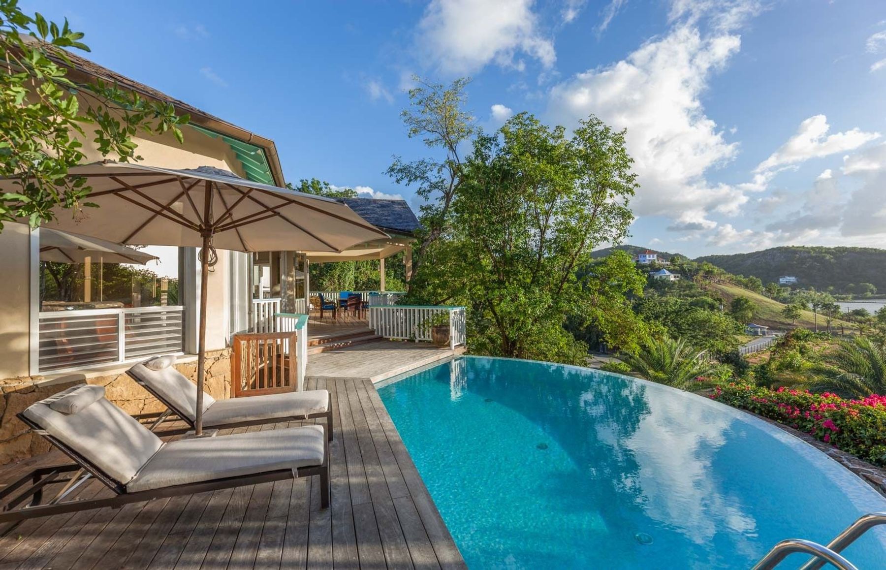 The infinity edge pool at Galley Bay Heights #001 over looks the hillside at Galley Bay