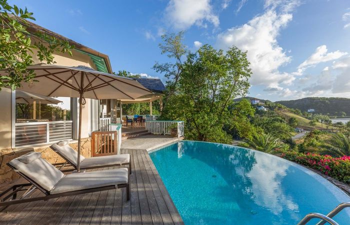The infinity edge pool at Galley Bay Heights #001 over looks the hillside at Galley Bay