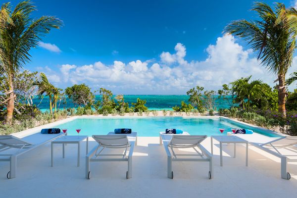 At Sandcastle you can lounge by the pool and enjoy the beautiful Caribbean ocean at the same time