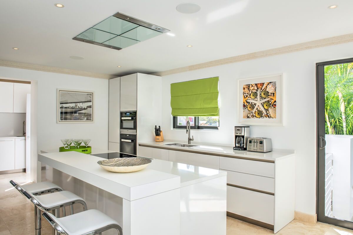 Kitchen area with breakfast bar that seats three