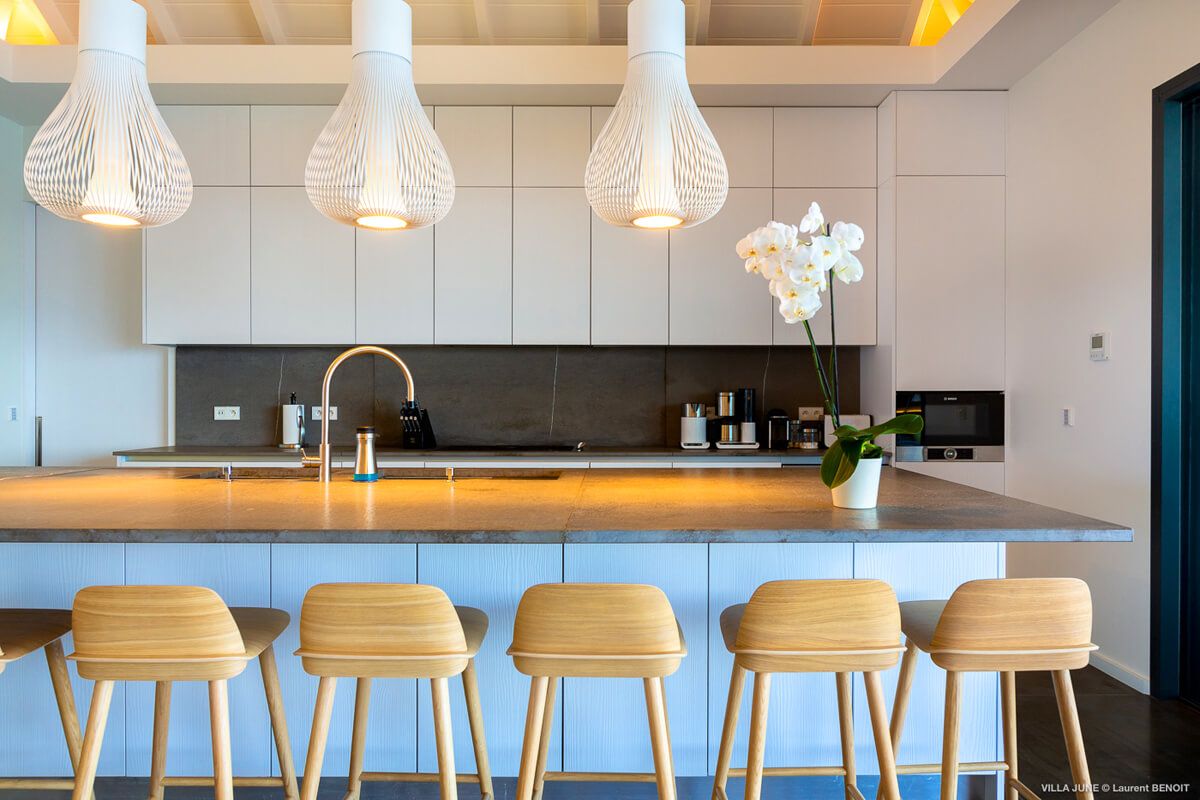 A well-equipped kitchen with a breakfast bar that seats six