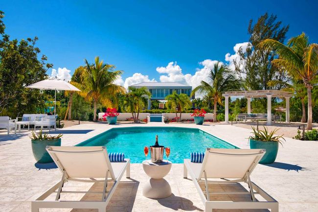 Seagrace Villa is located on the Ailla Canal in the gated community of Leeward