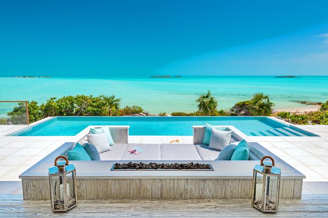 The pool at Bristol Bliss sits beachside overlooking the azure waters so famous in Turks and Caicos