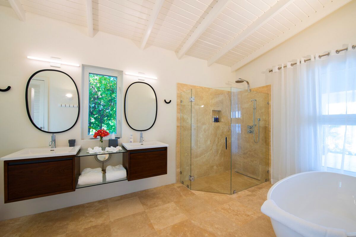 En suite bathroom with shower and bathtub