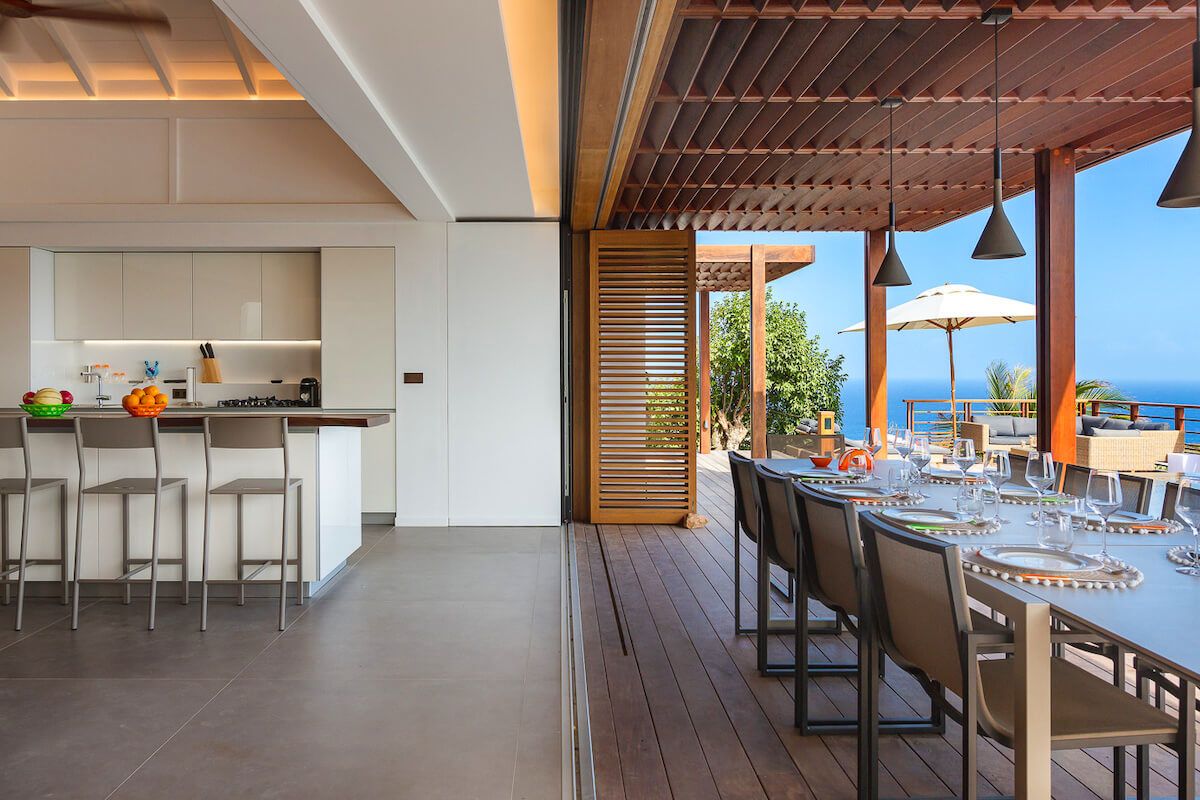 Breakfast bar seating and a large dining table