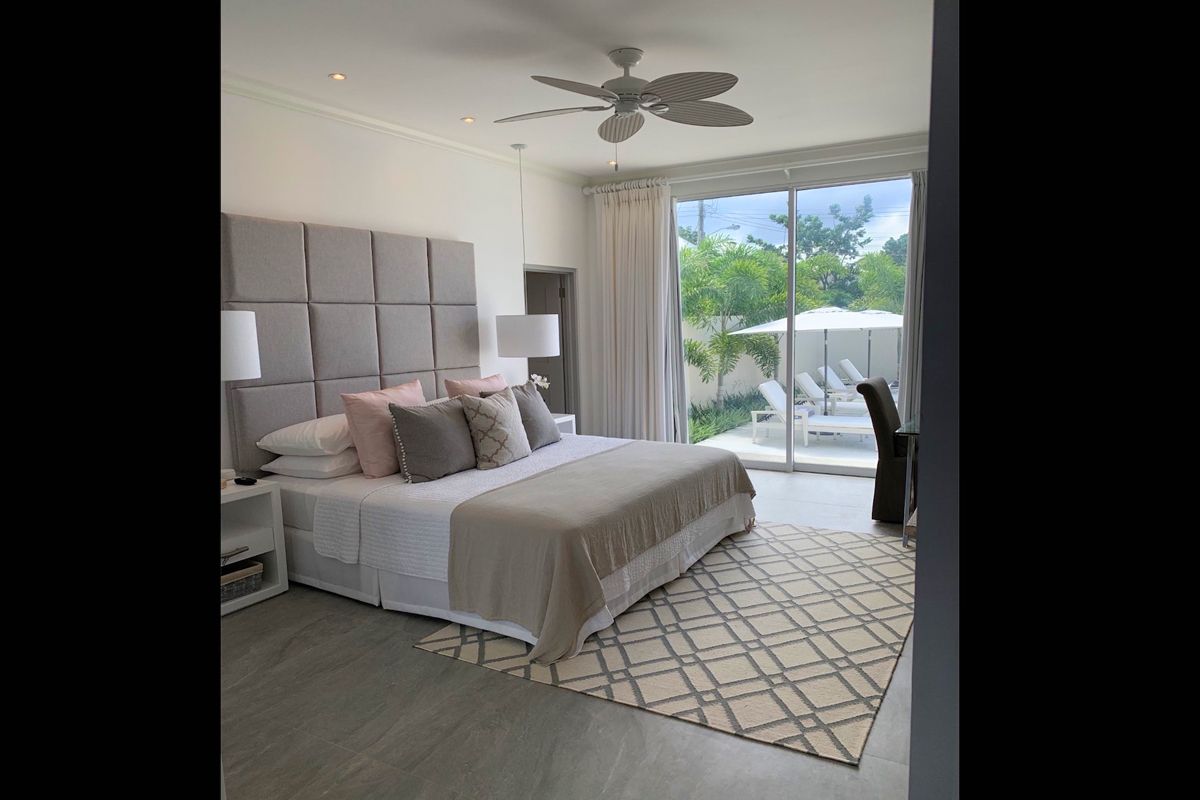 King bedroom with patio access