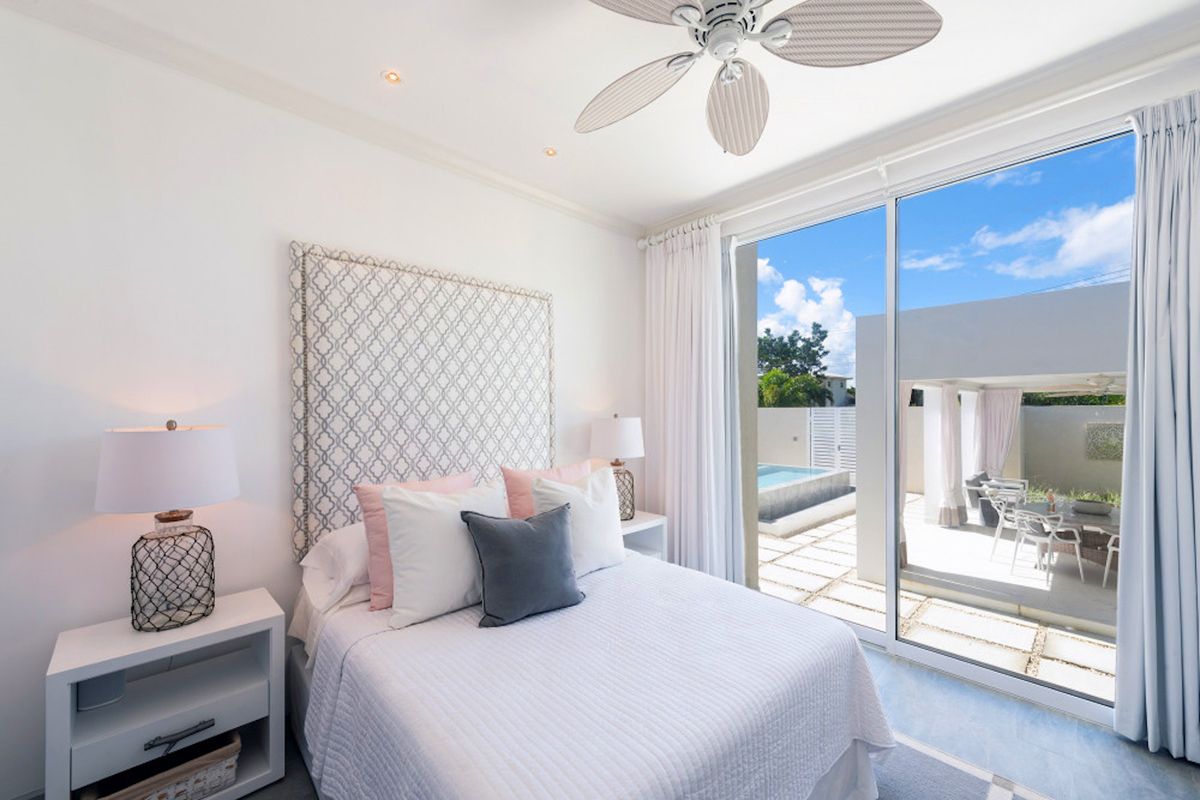 King bedroom with patio access