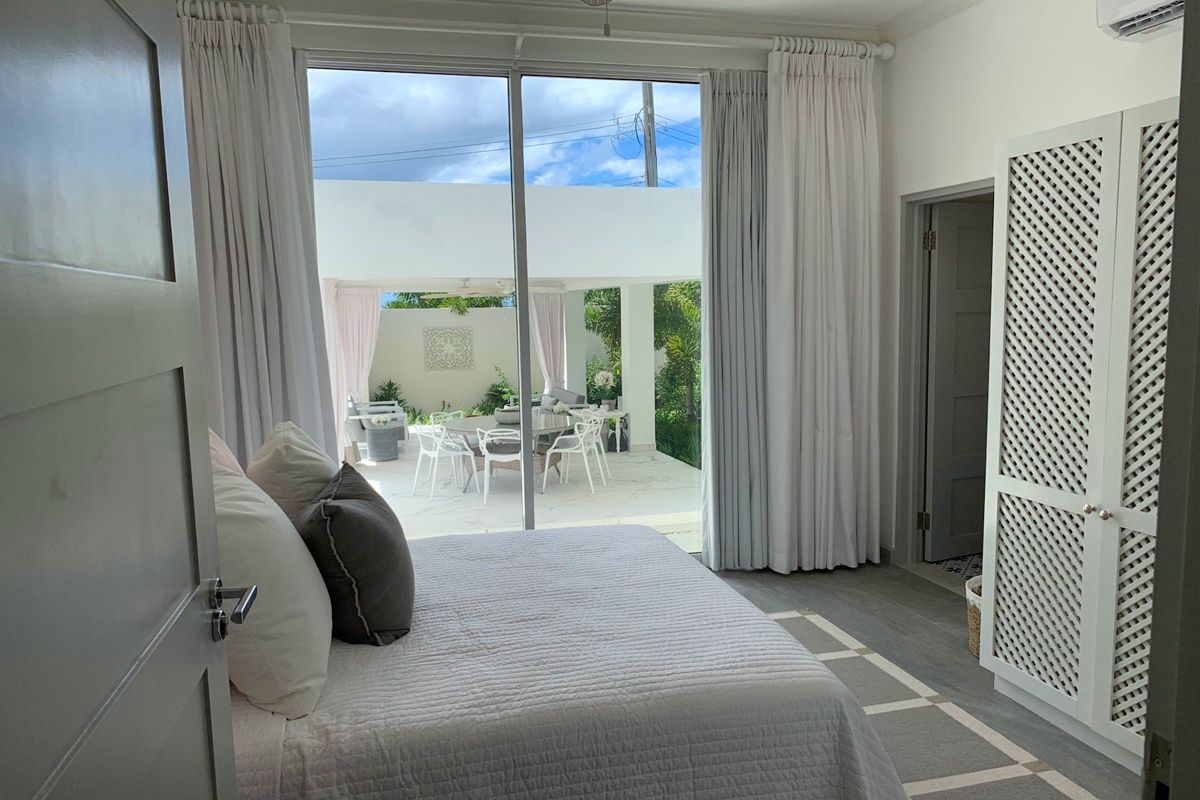 King bedroom with patio access