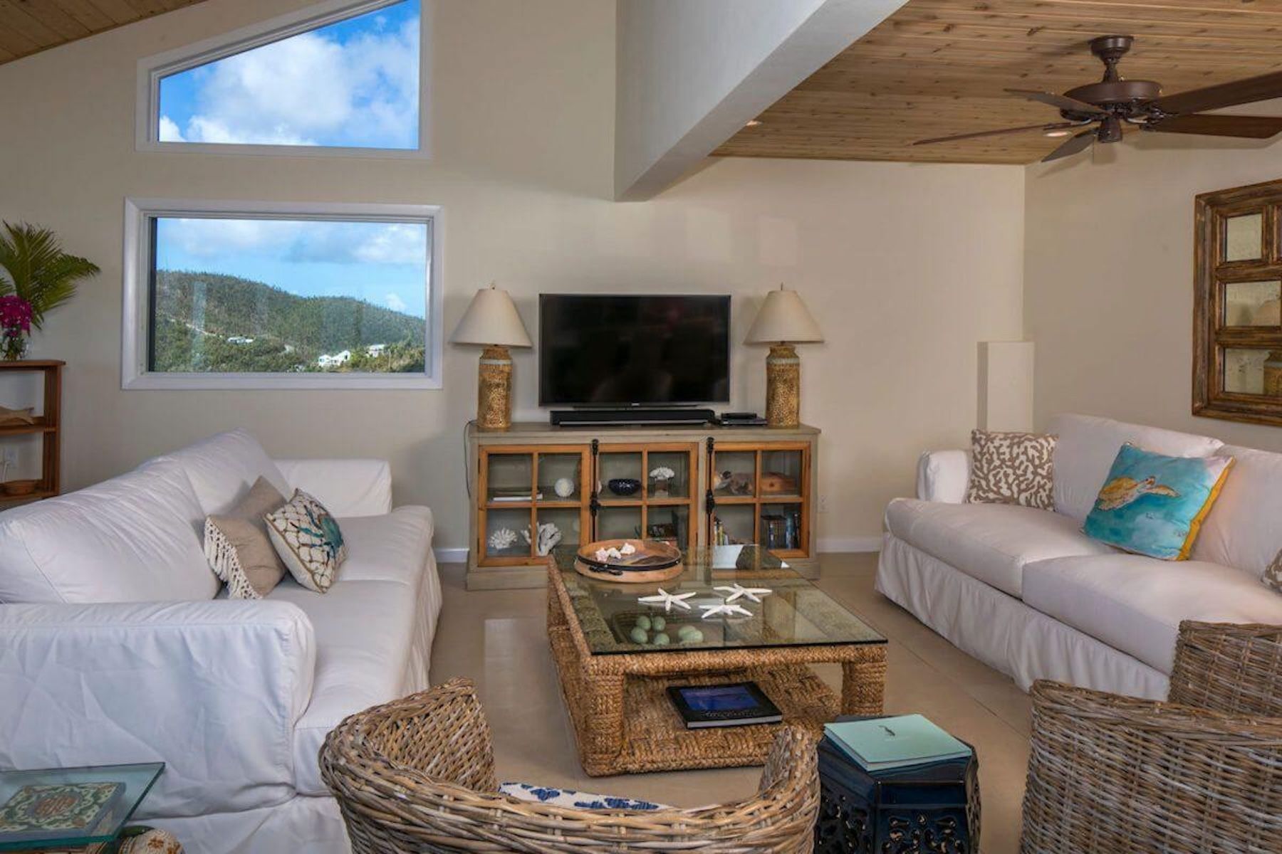 Bright villa living room with comfortable sofas and natural light