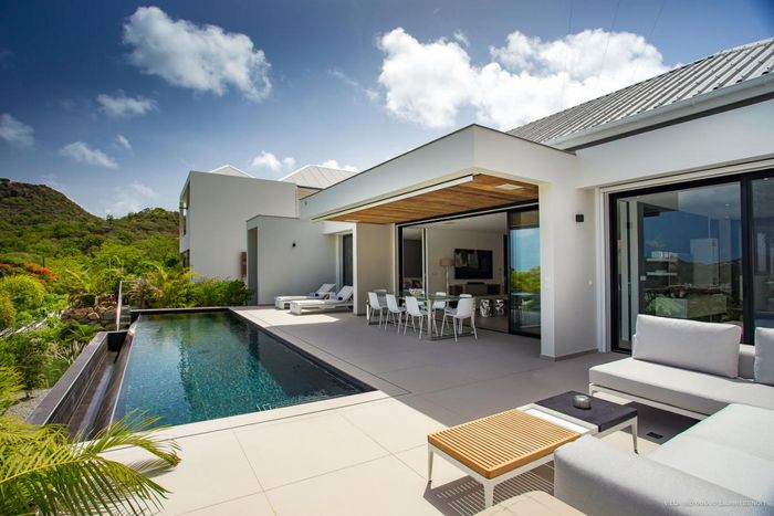 Patio deck and pool at Villa Indyana