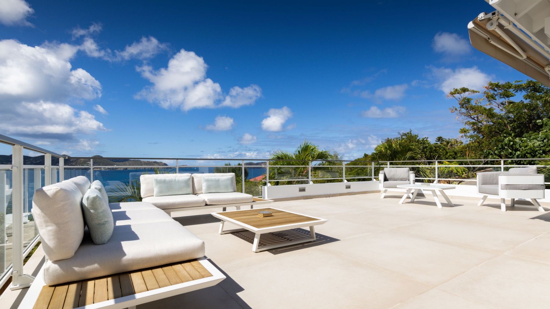 Poolside terrace with daybeds and loungers
