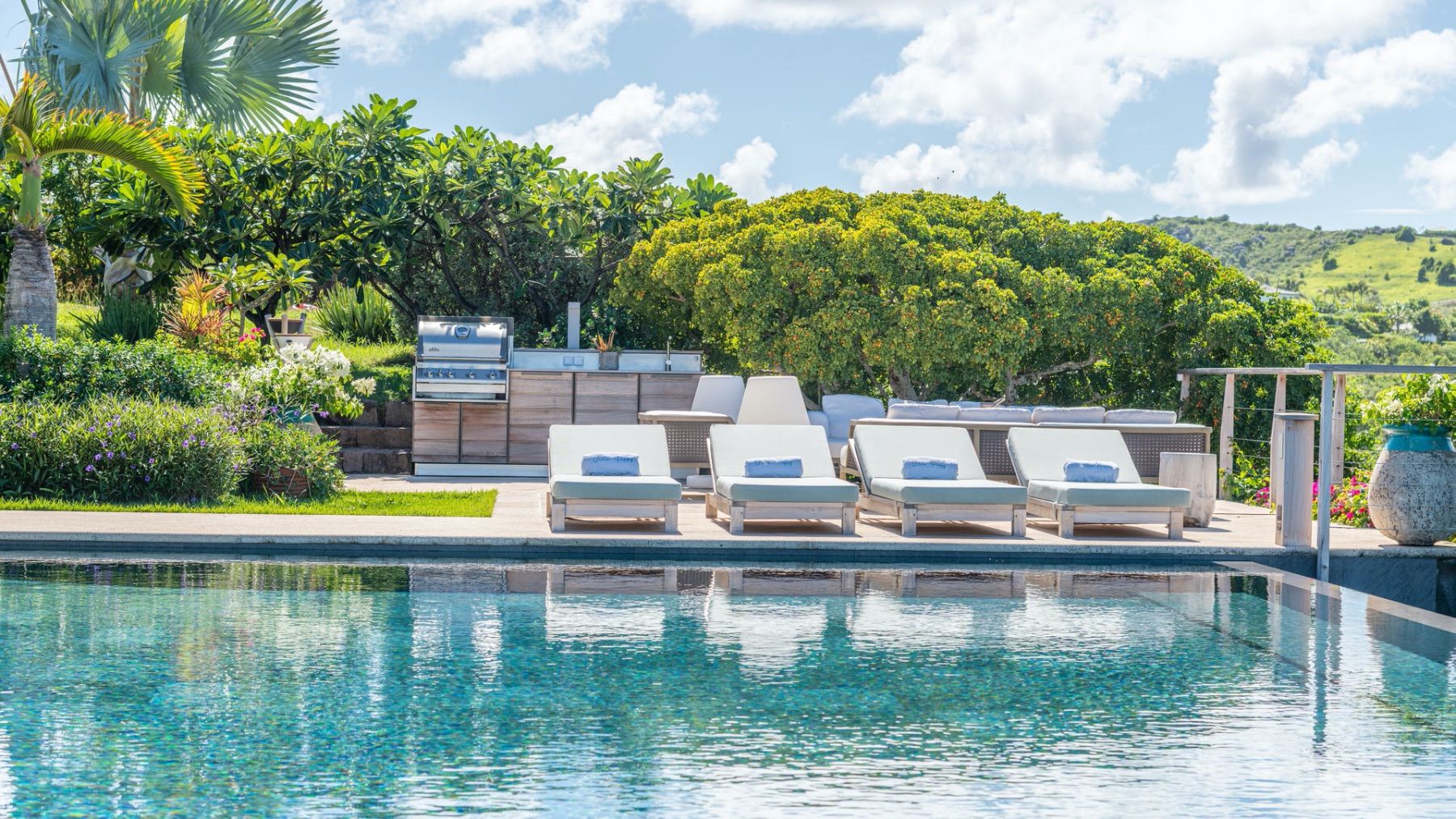 Adjacent loungers by the pool