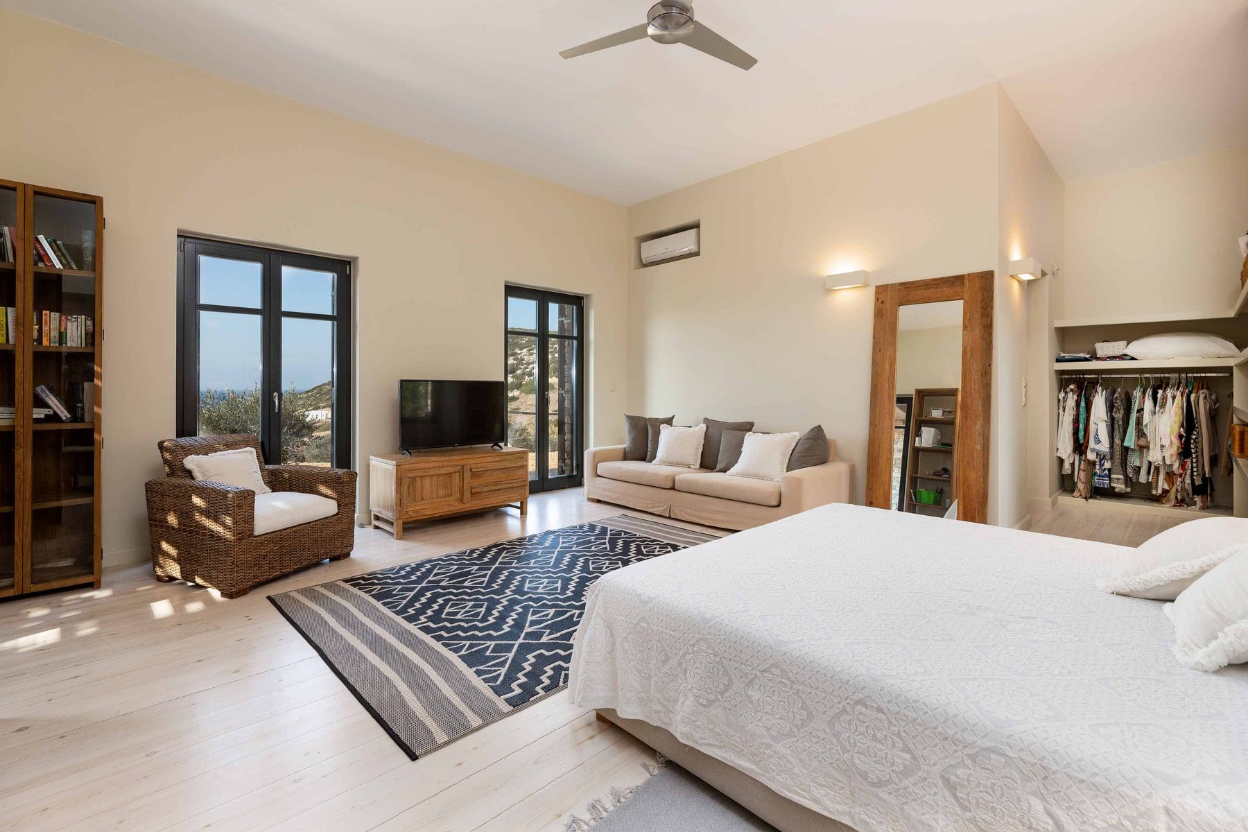 Master bedroom in the main house with olive grove views