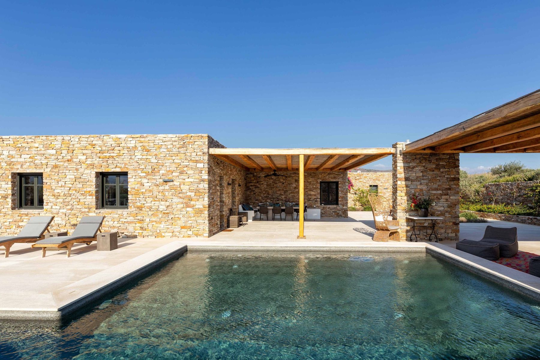 Shaded dining area overlooking the pool