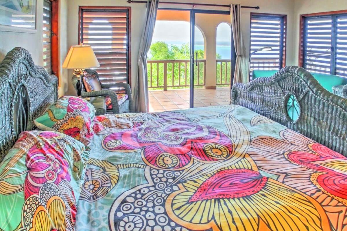 King bedroom with balcony access