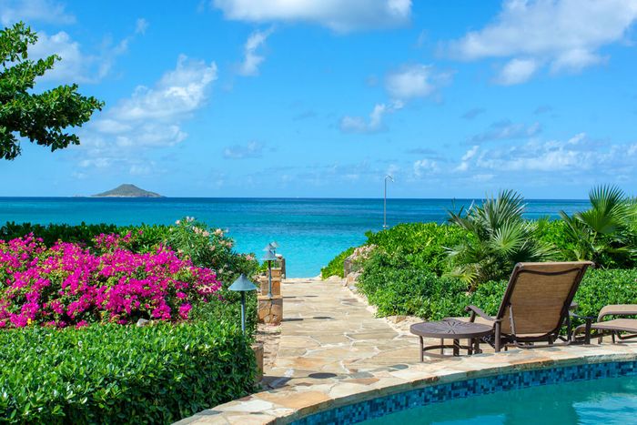 Beachcomber Villa is located right on Mahoe Bay Beach