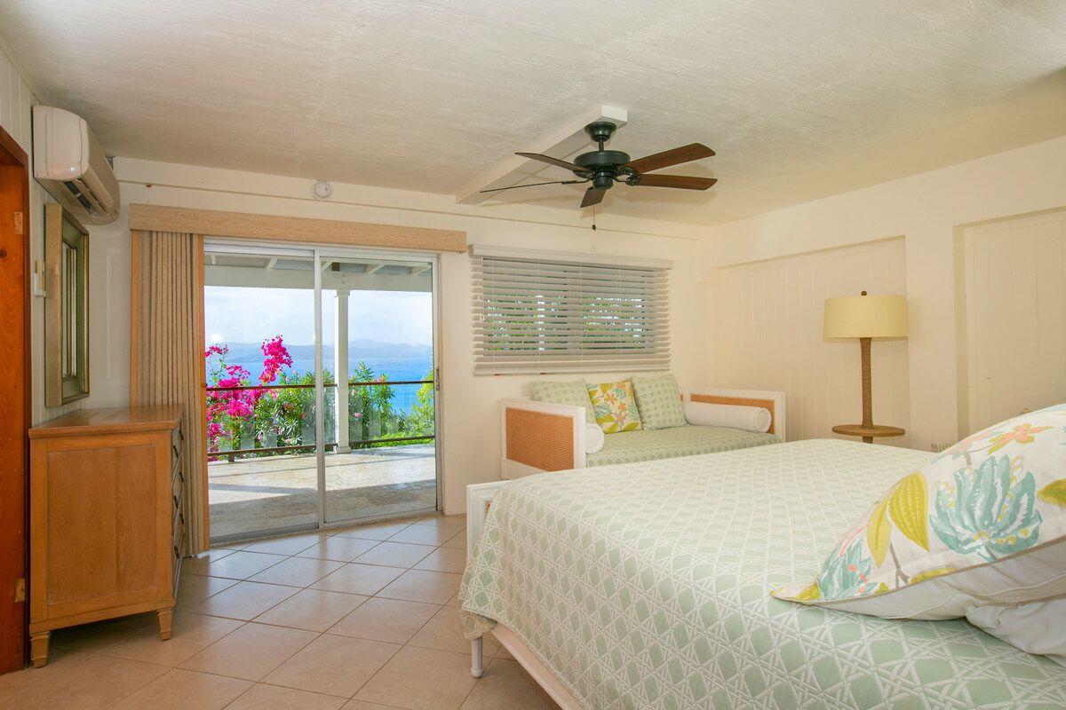 King bedroom with patio access