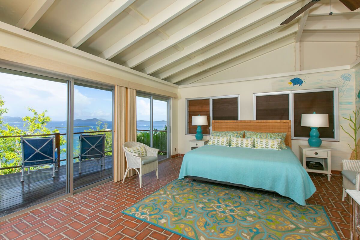 King bedroom with patio access