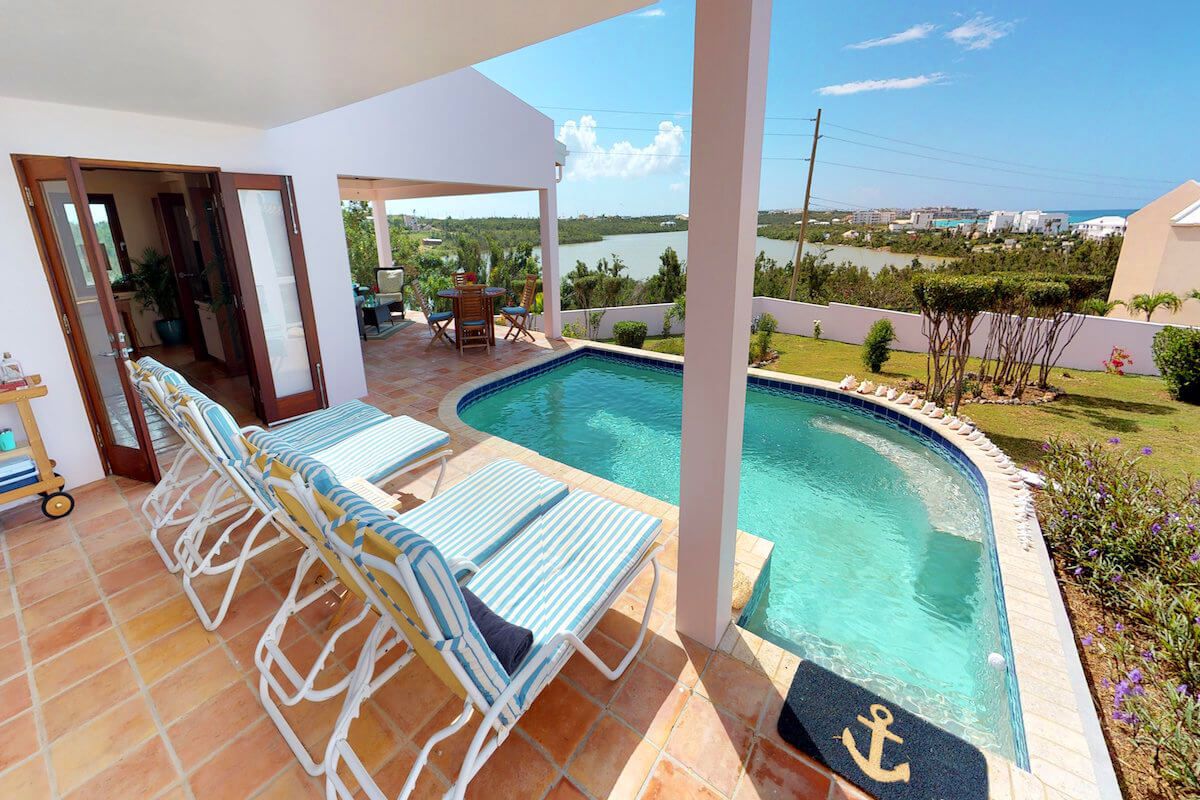 Back yard overlooking Meads Bay pond and the Caribbean just beyond