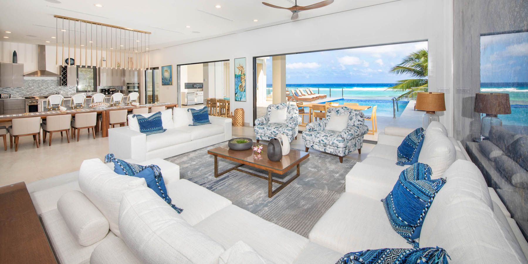 Open living area featuring views out to the swimming pool and sea
