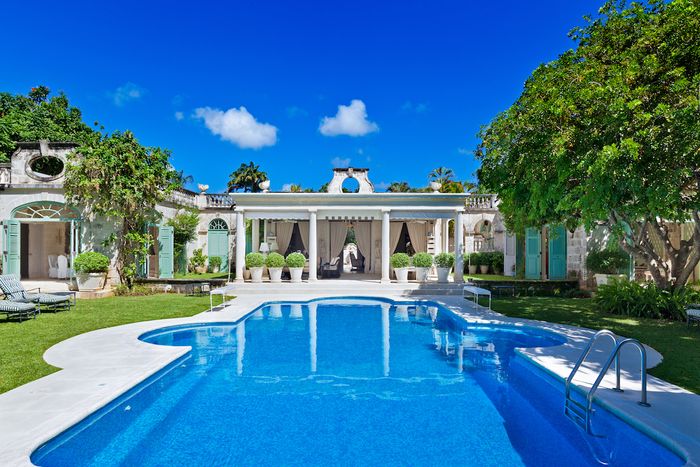 Manicured landscaping and the large pool 