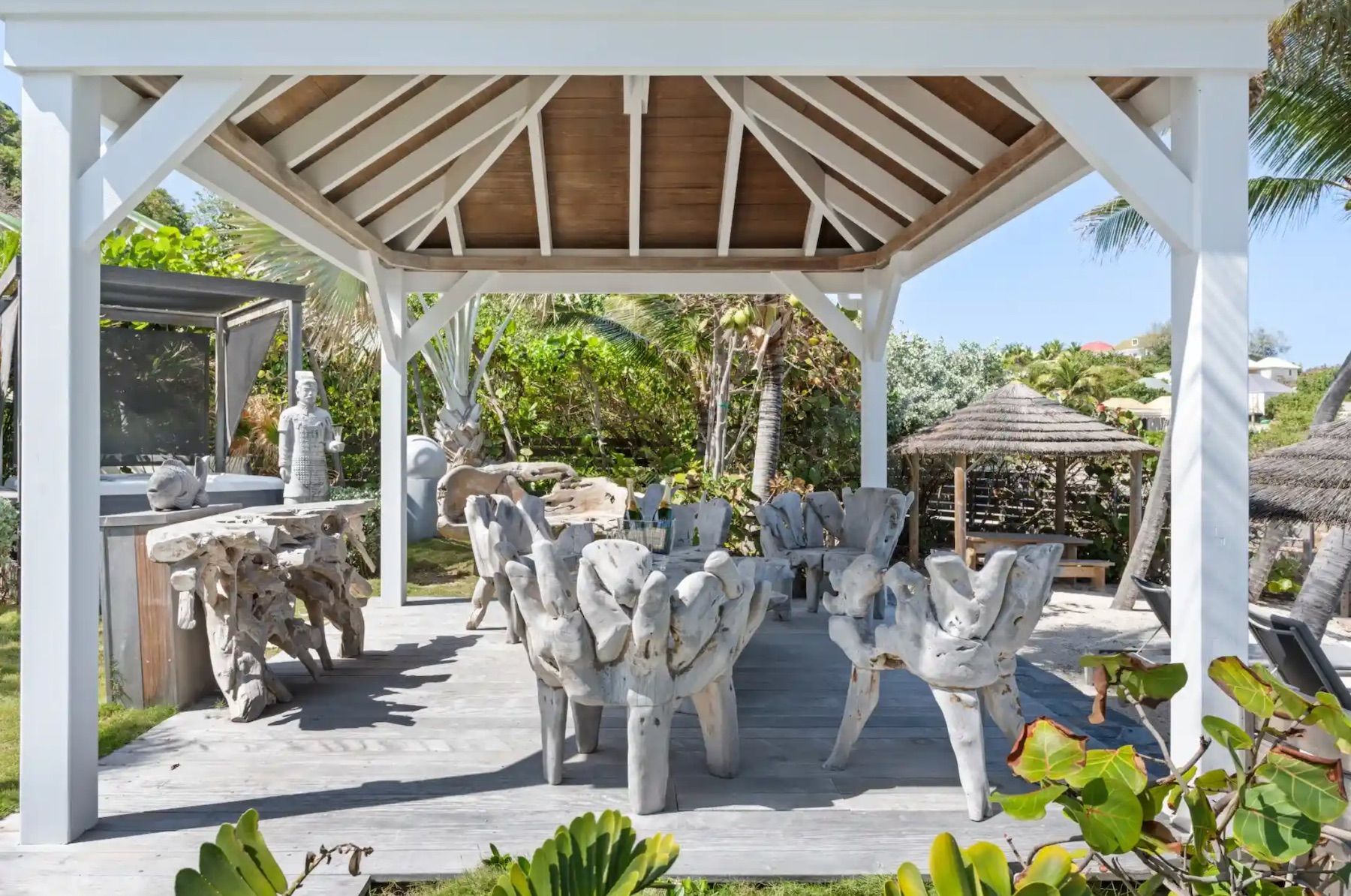Gazebo by the beach with outdoor furniture
