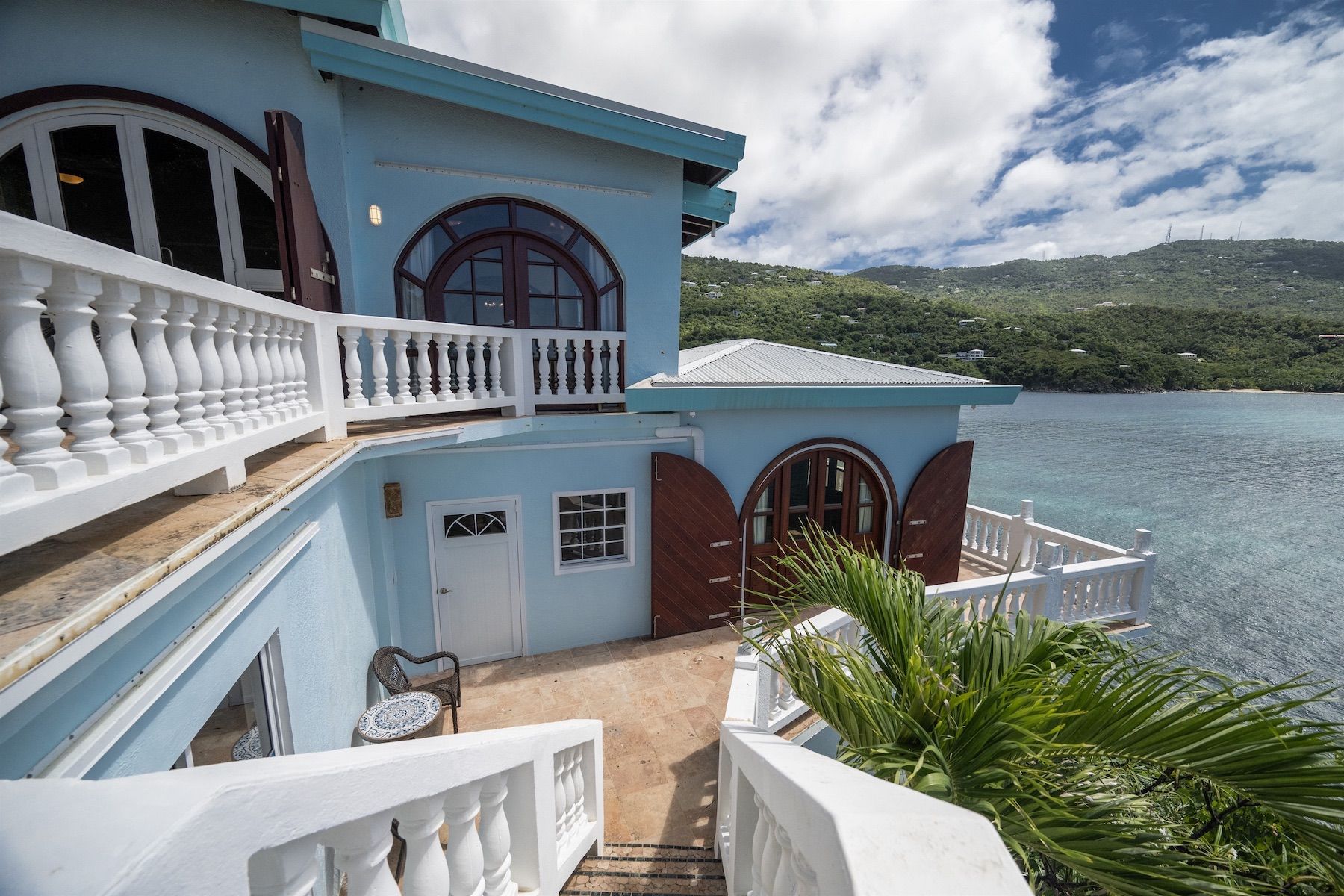 Exterior stairs leading down to the pool level.
