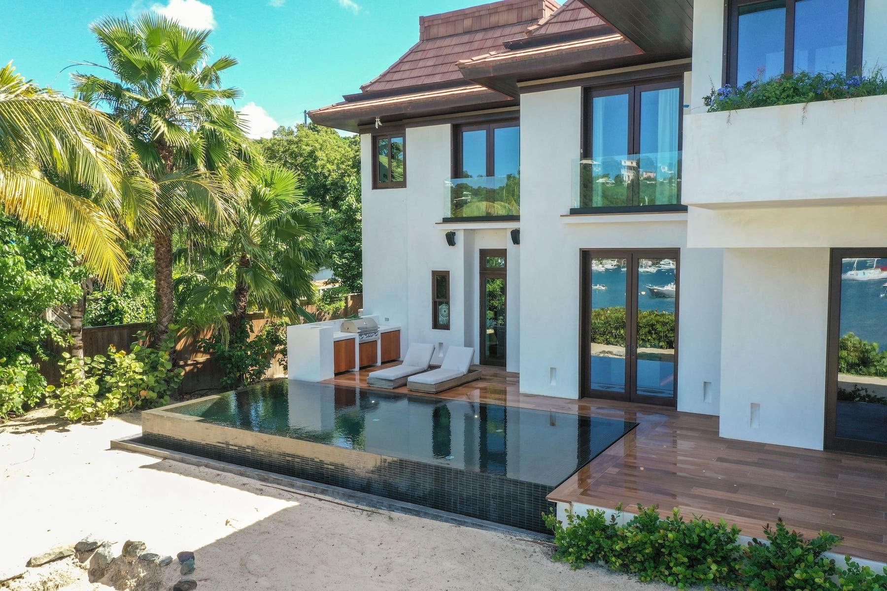 Infinity edge swimming pool with views to the beach