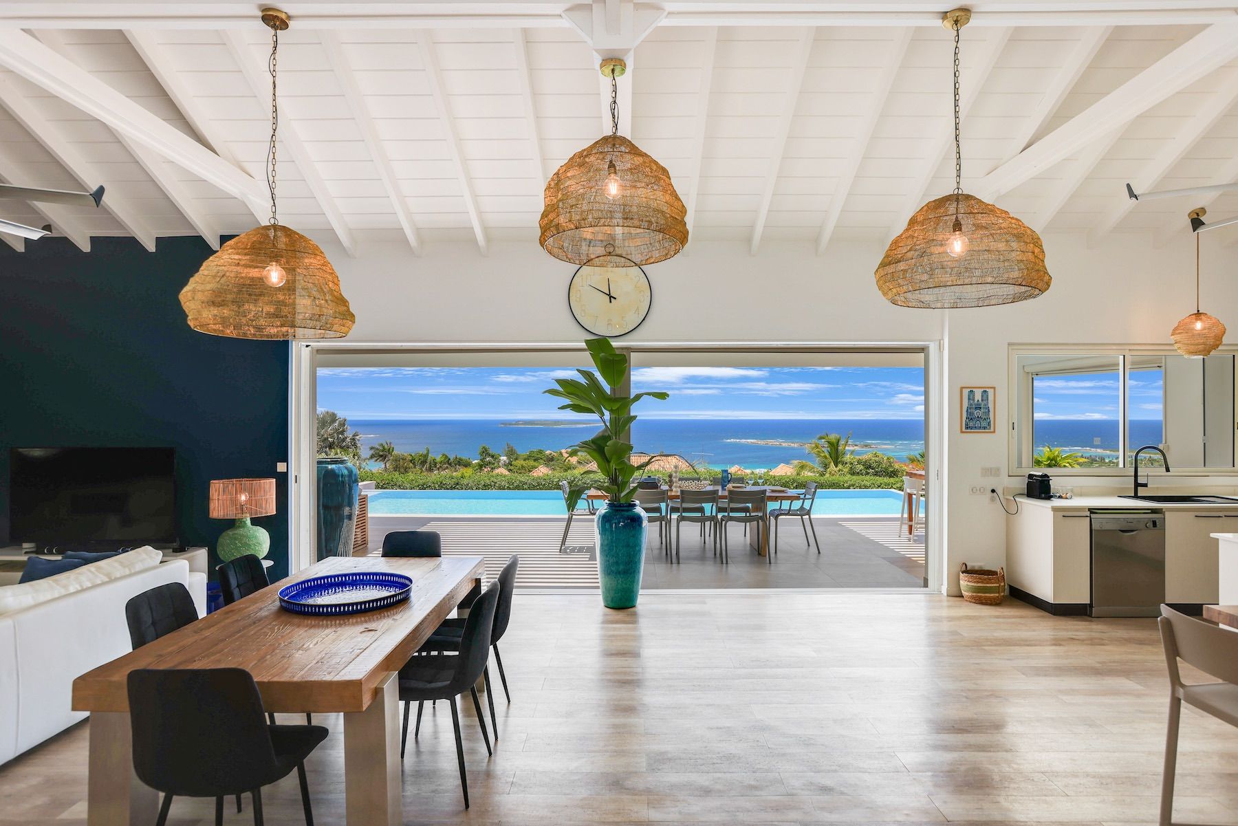 Open living area with views out to the pool 
