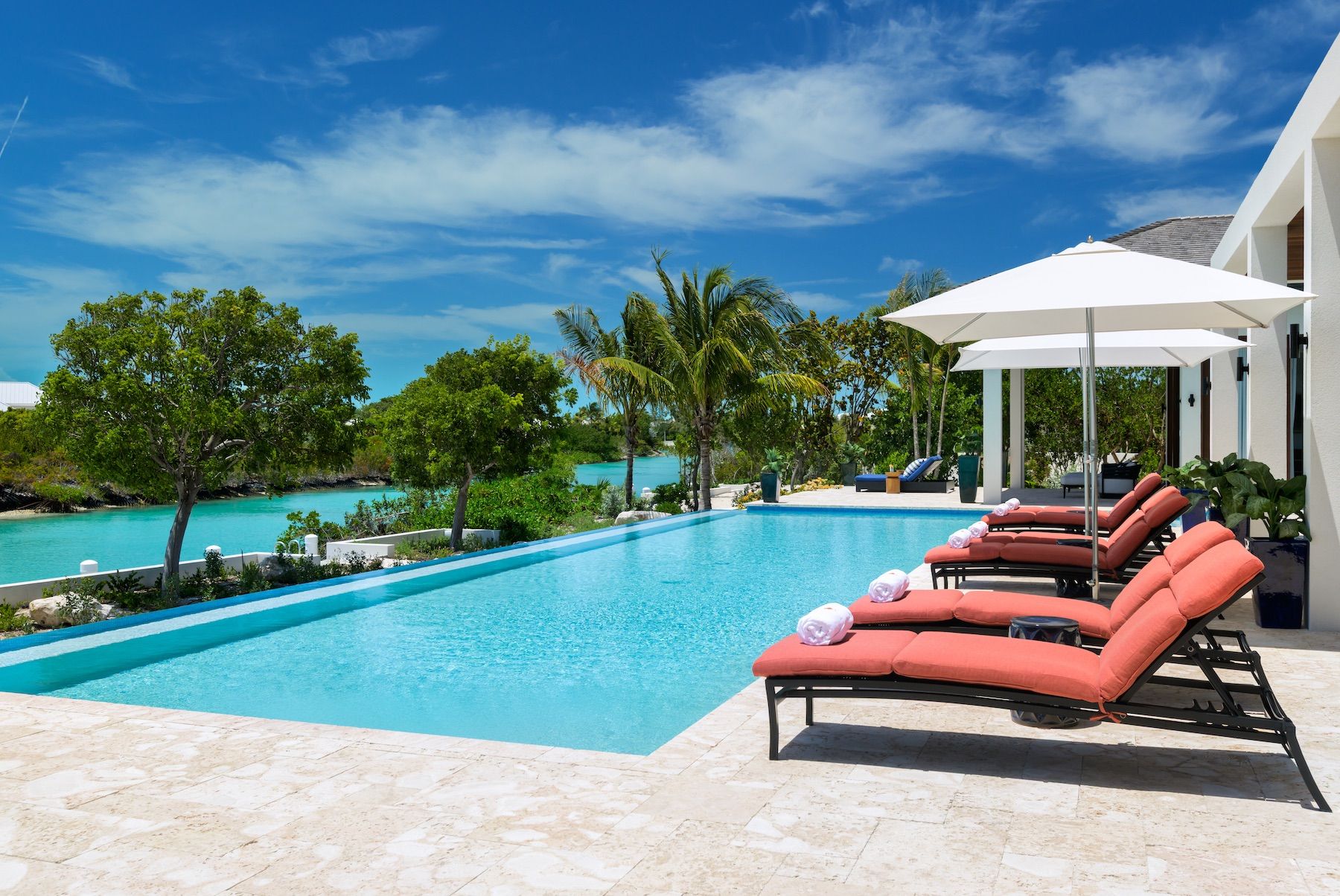 Sun loungers sit adjacent to the swimming pool
