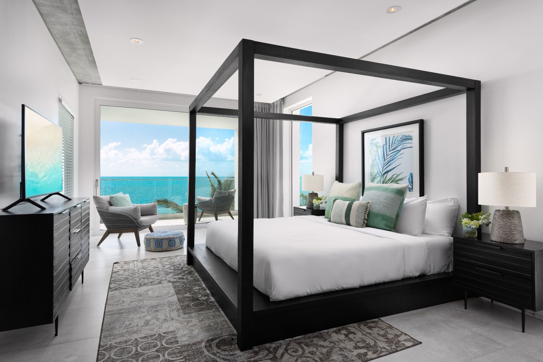 Upper Level Bedroom with balcony and views to the water