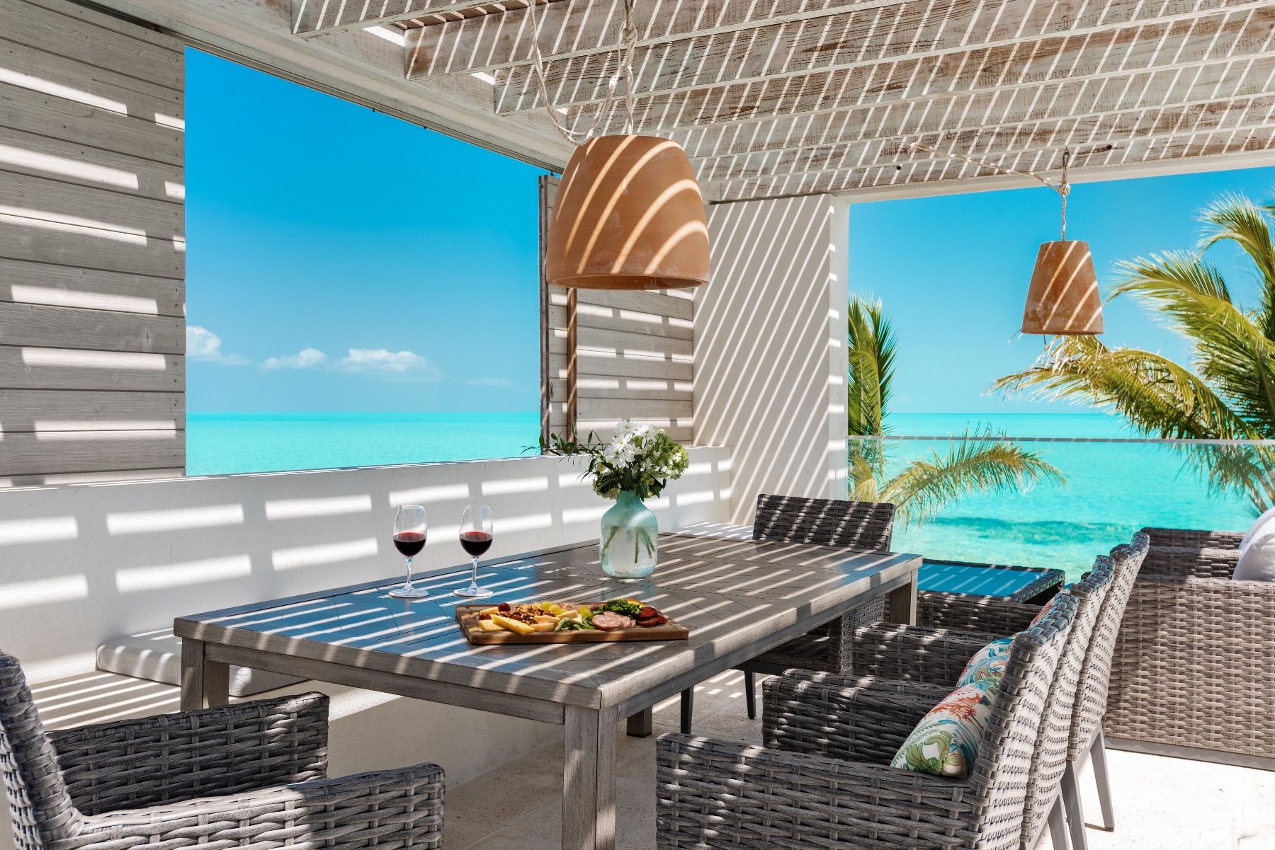 Alfresco dining with views to the sea and swimming pool