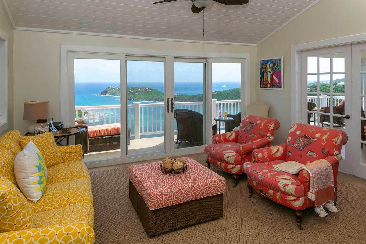 The living area has a sliding glass door that opens to the patio