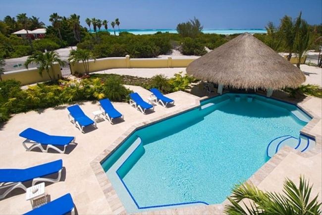 The pool and palapa at Pelican Vista Villa