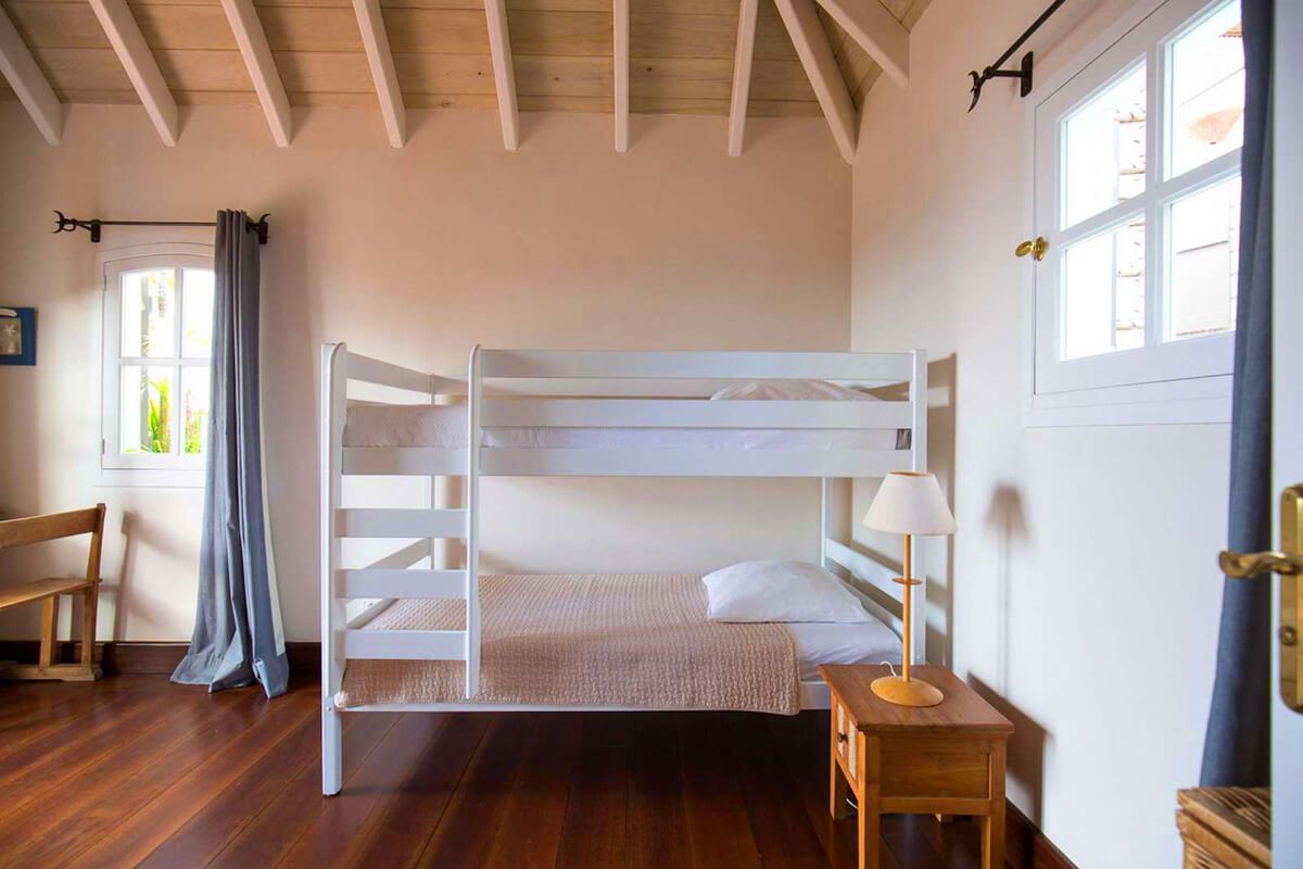 A fifth bedroom with twin bunk beds