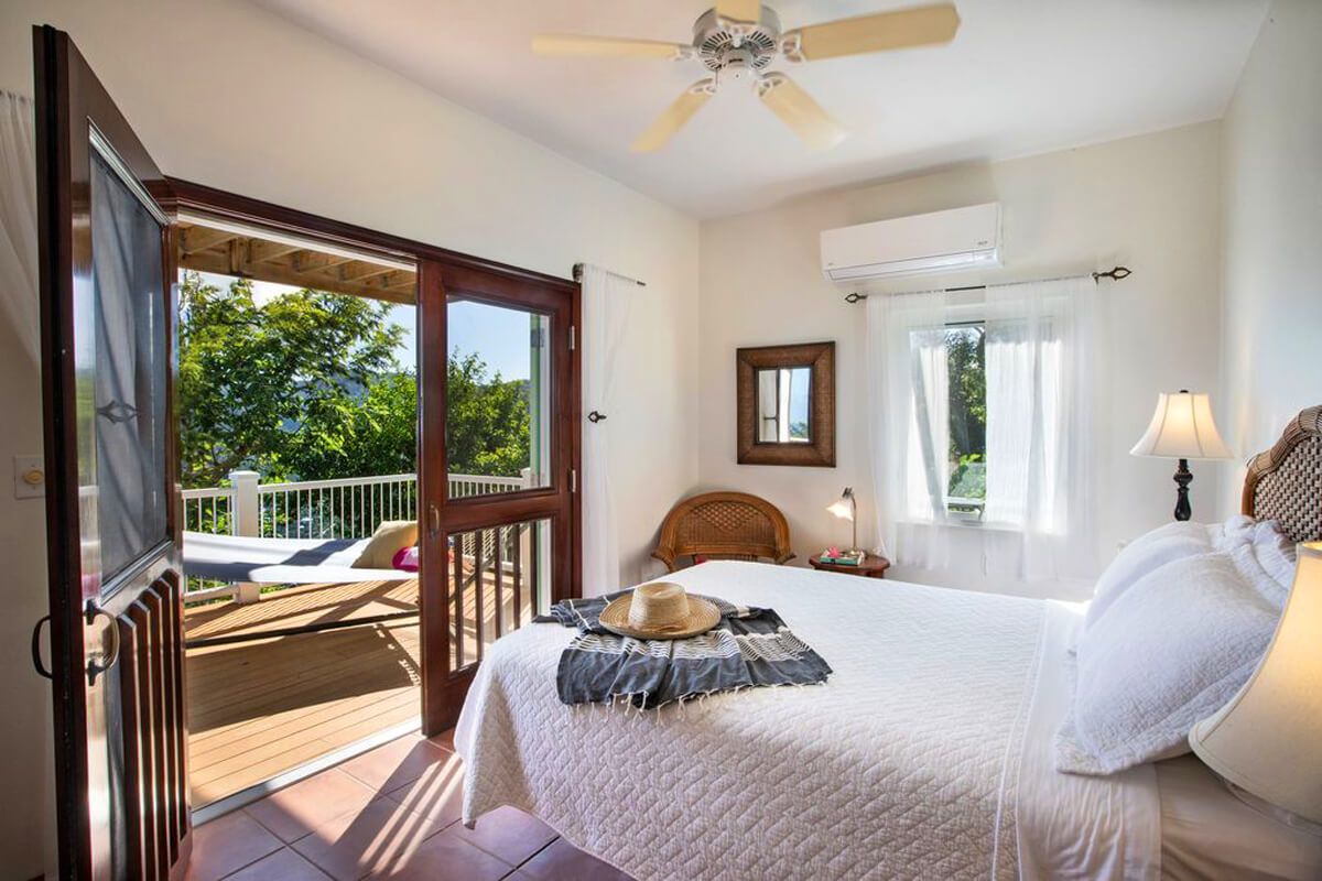 Lower level bedroom with a king bed