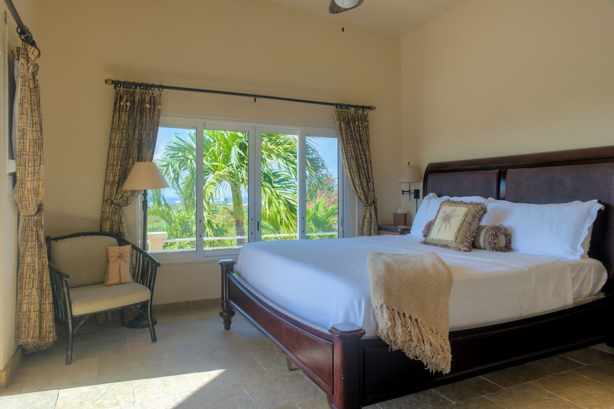 Master bedroom with a king bed