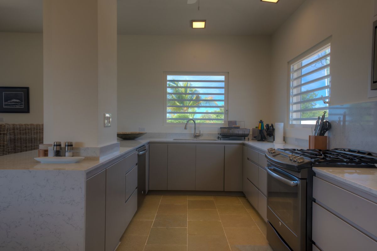 Kitchen has a pass over bar to the dining area