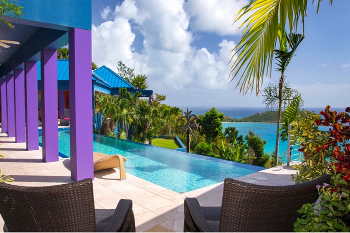 Mare Blu is located hillside on the exclusive Rendezvous Bay overlooking the south shore