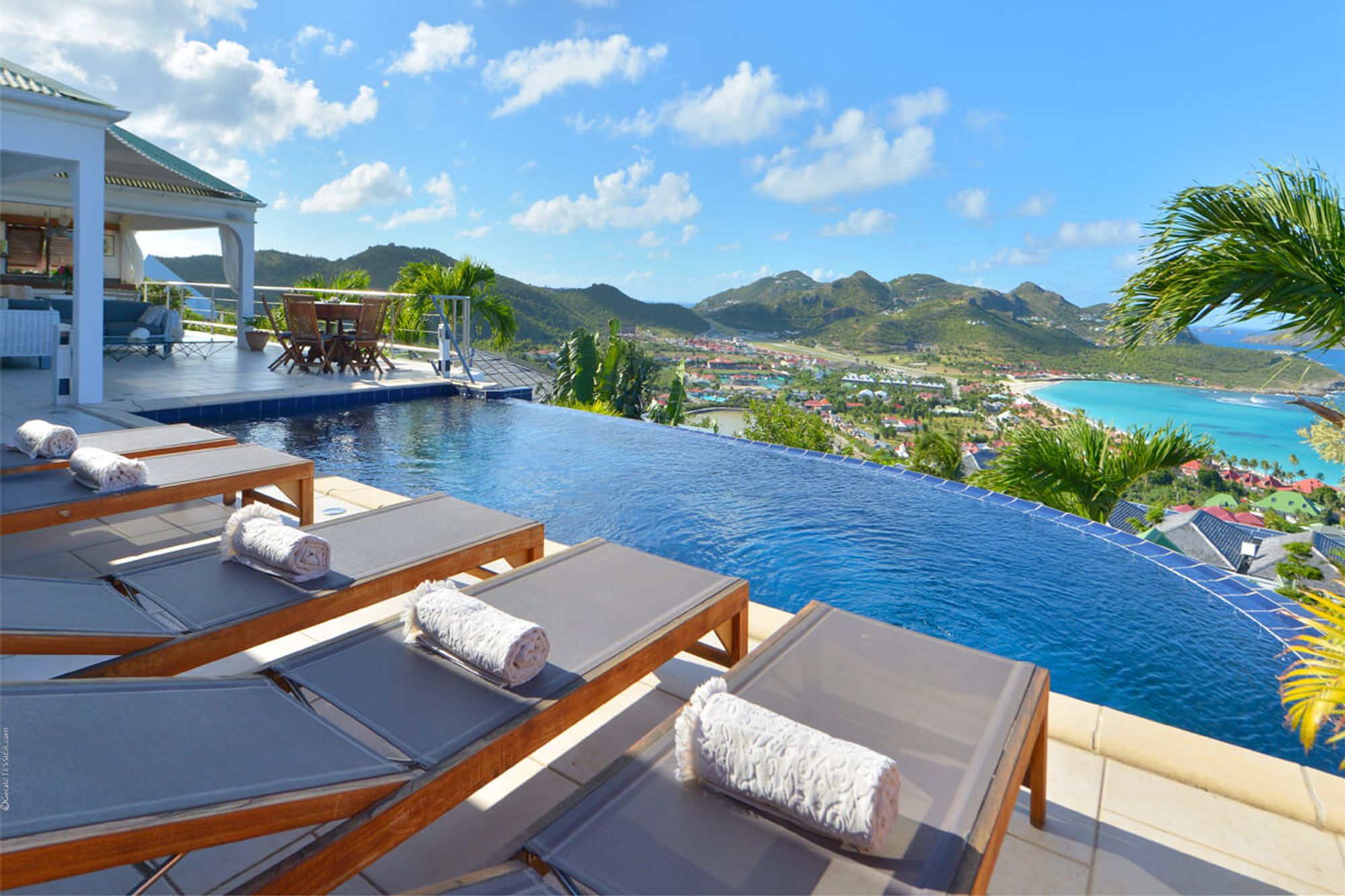 Lounge by the infinity pool and enjoy veis of St. Jean and the beach