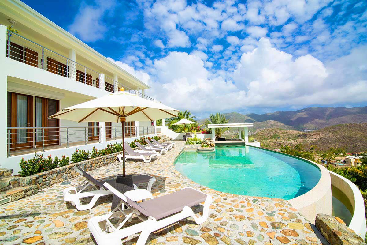 Sun loungers by the infinity pool